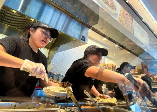 Workers prepare food orders at a Chipotle restaurant in San Rafael, Calif., on April 1, 2024. (Justin Sullivan/Getty Images)