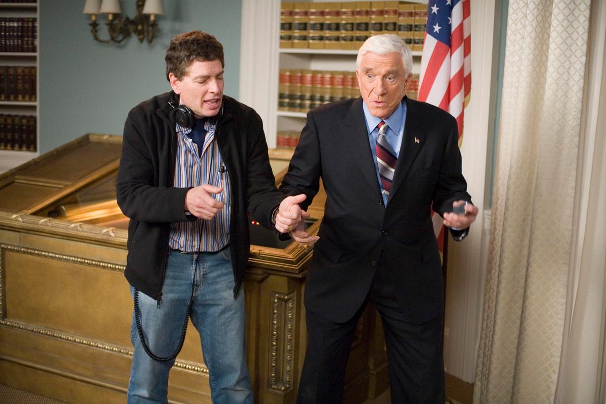 A behind-the-scenes shot of David Zucker directing Leslie Nielsen in “Scary Movie 4.” The latter played a fictional version of the U.S. president. (MovieStillsDB)