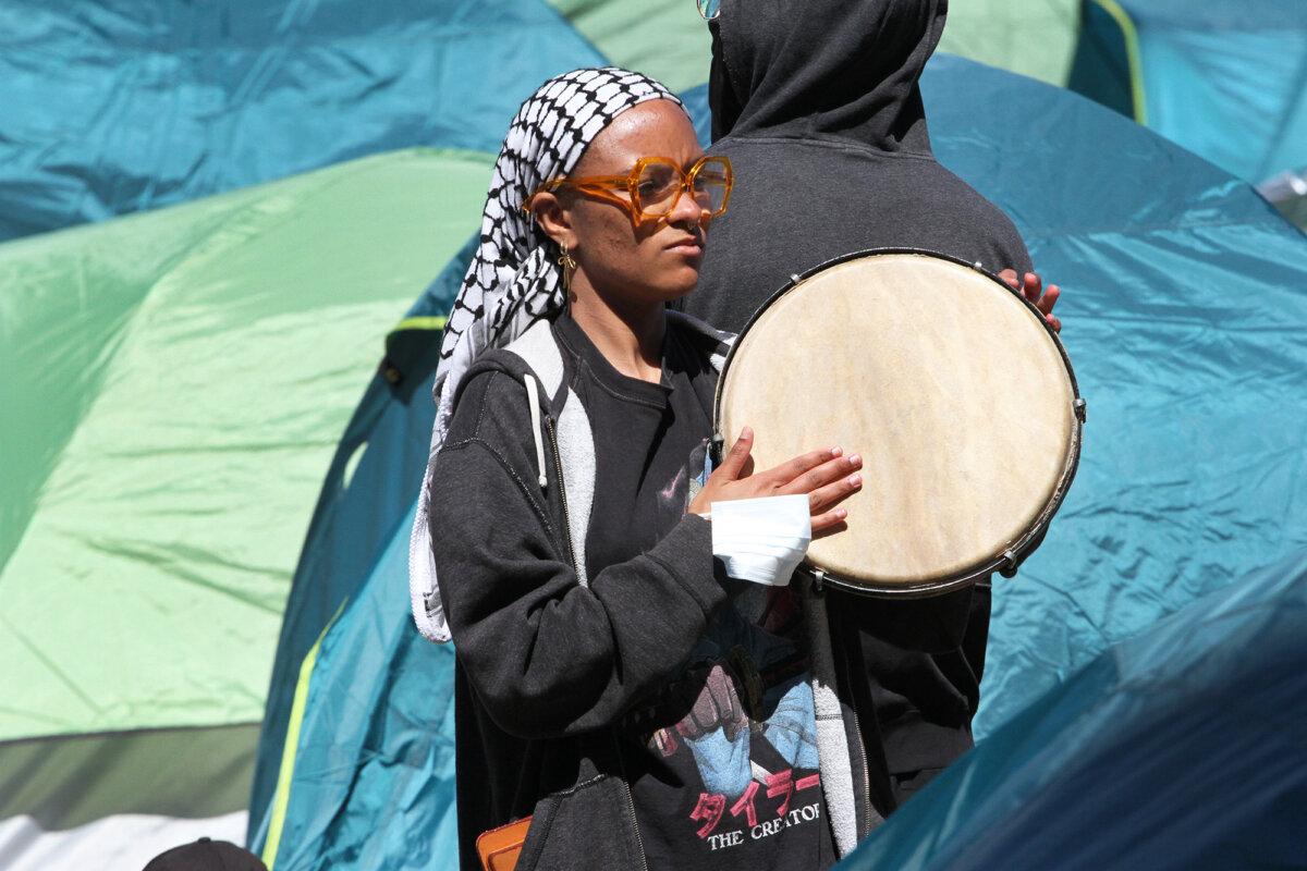 A pro-Palestinian protester in the encampment on the Columbia University campus in New York City on April 23, 2024. (Richard Moore/The Epoch Times)
