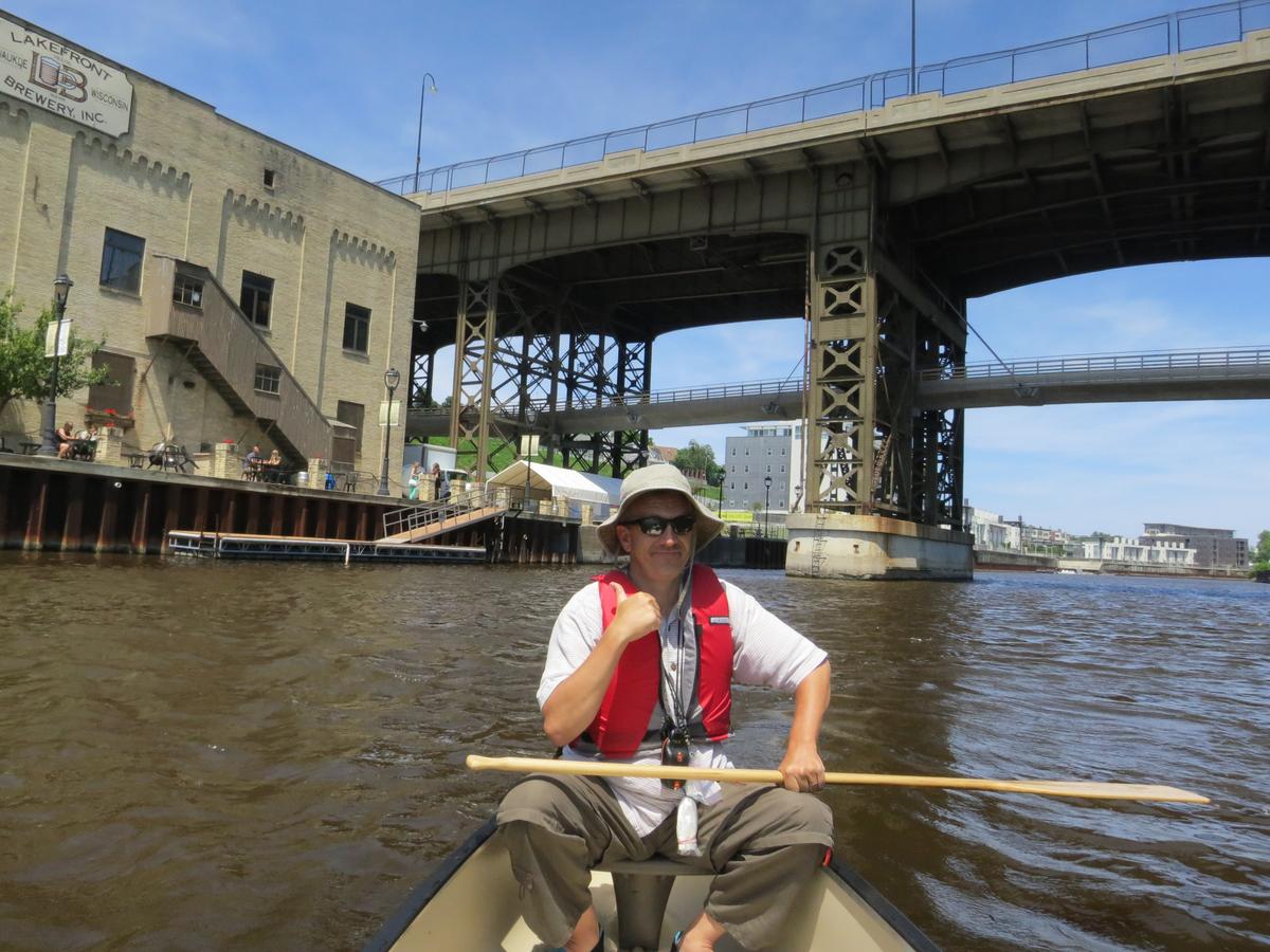 Safety precautions should be taken while paddling on the Milwaukee River, including wearing personal flotation devices (PFDs) and being aware of potential hazards such as submerged objects and changing water conditions. (Courtesy of Kevin Revolinski)