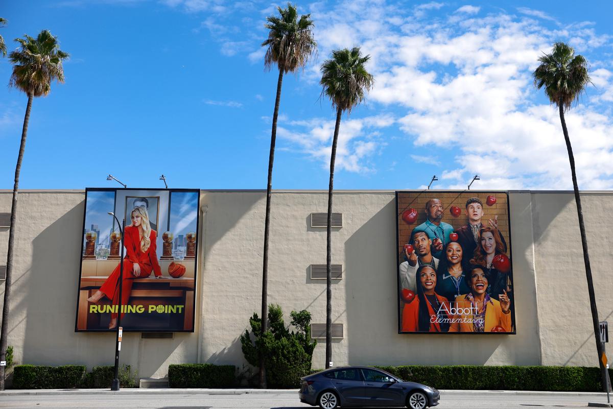 A car passes Warner Bros. Studio in Burbank, Calif., on Oct. 21, 2025. Warner Bros. Discoveryowns CNN, HBO, and other studio and streaming businesses. (Mario Tama/Getty Images)