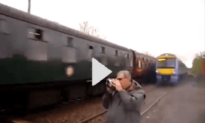 Train Spotter Inches From Being Killed by Train (Video)