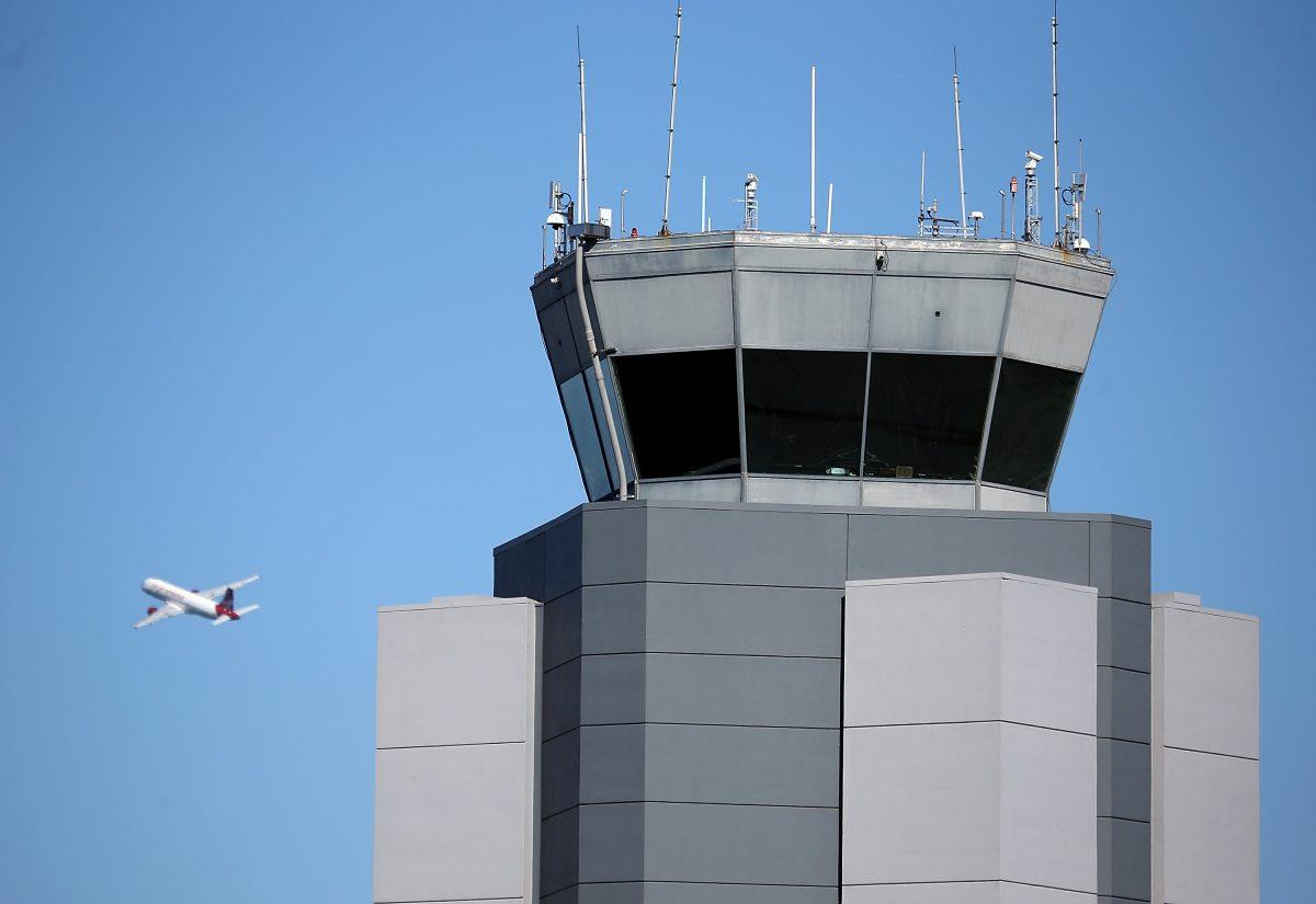 A plane takes off near the control tower at San Francisco International Airport on Feb. 25, 2013 in San Francisco, Calif. A flight from San Francisco to Hong Kong was close enough to observe North Korea's ballistic missile test on Nov. 28. (Justin Sullivan/Getty Images)