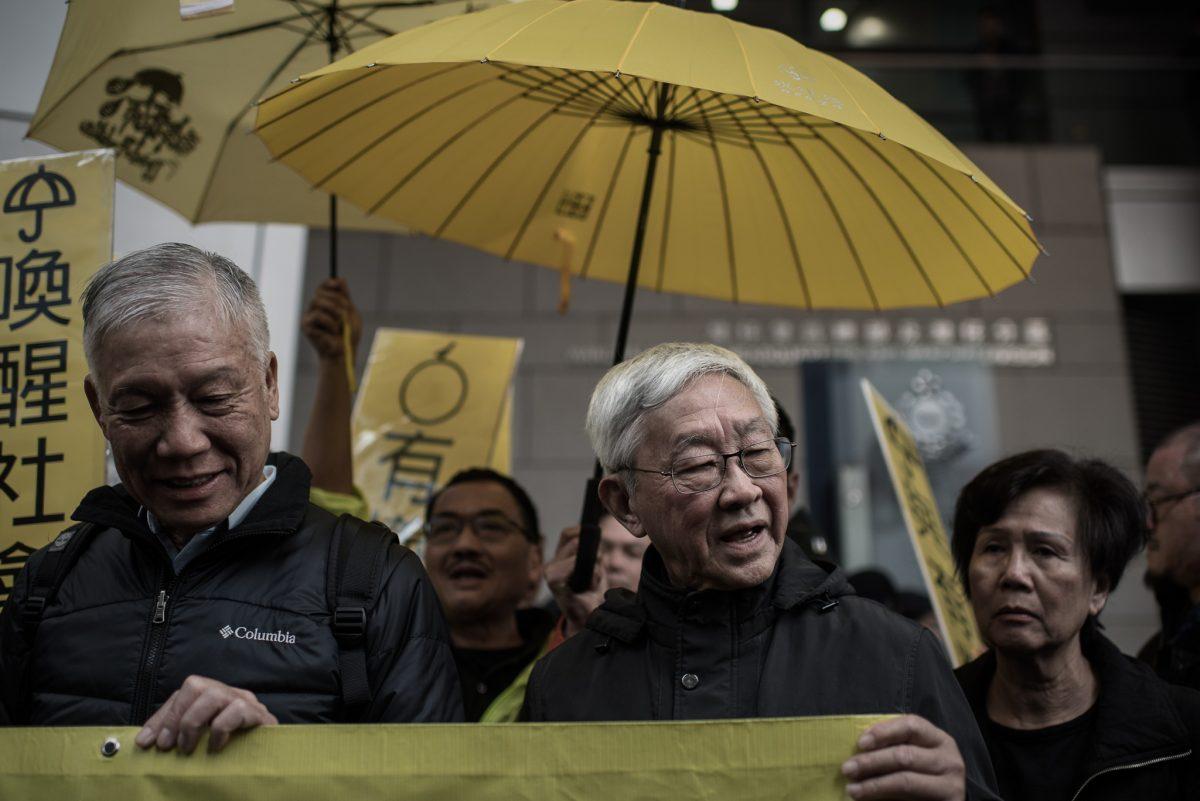 In this stock photo, Cardinal Joseph Zen Ze-kiun (C), Hong Kong's outspoken former bishop, looks on as he joins leading pro-democracy activists in front of the Wanchai police station in Hong Kong on Jan. 24, 2015. (Philippe Lopez/AFP/Getty Images)