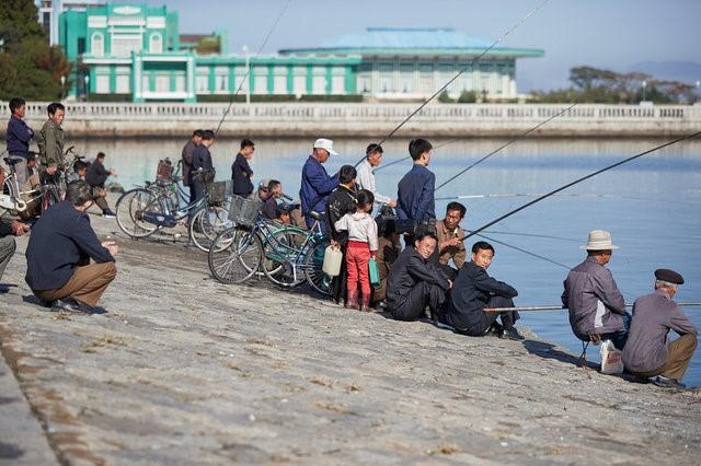 People fish in the Bay of Wonsan, North Korea in October 2016. (Christian Peterson-Clausen/Handout via Reuters)