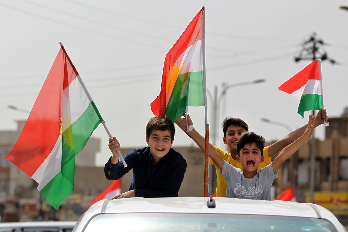 Iraqis Kurds celebrate with the Kurdish flag in the streets of the northern city of Kirkuk on Sept. 25, 2017 as they vote in a referendum on independence.<br/>(AHMAD AL-RUBAYE/AFP/Getty Images)
