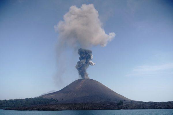 A plume of ash rises from Anak Krakatau (Child of Krakatoa) volcano as seen from Rakata island in South Lampung. July 18, 2018. (Ferdi Awed/AFP/Getty Images)