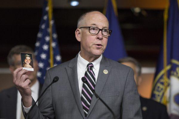 House Energy and Commerce Committee Chairman Rep. Greg Walden (R-OR) with a photograph of Amanda Beatrice Rose Gray, who died from an opioid overdose, during a news conference on Capitol Hill on June 13, 2018, in Washington. (Zach Gibson/Getty Images)