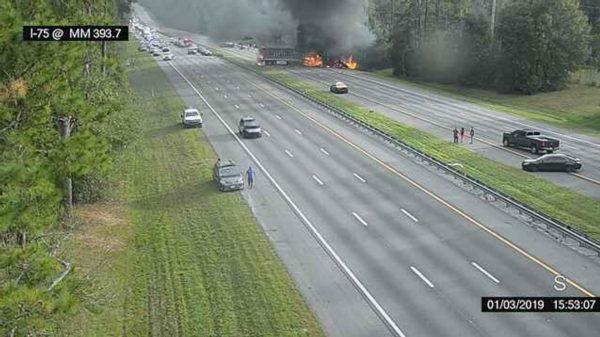 Image taken from a Florida 511 traffic camera shows a fiery crash along Interstate 75, on Jan. 3, 2019. (Alachua County Fire Rescue/Florida 511 via AP)