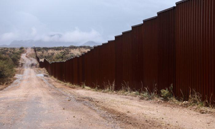 Video Shows Dozens of Families Walk Illegally Around Border Fence and Into the United States
