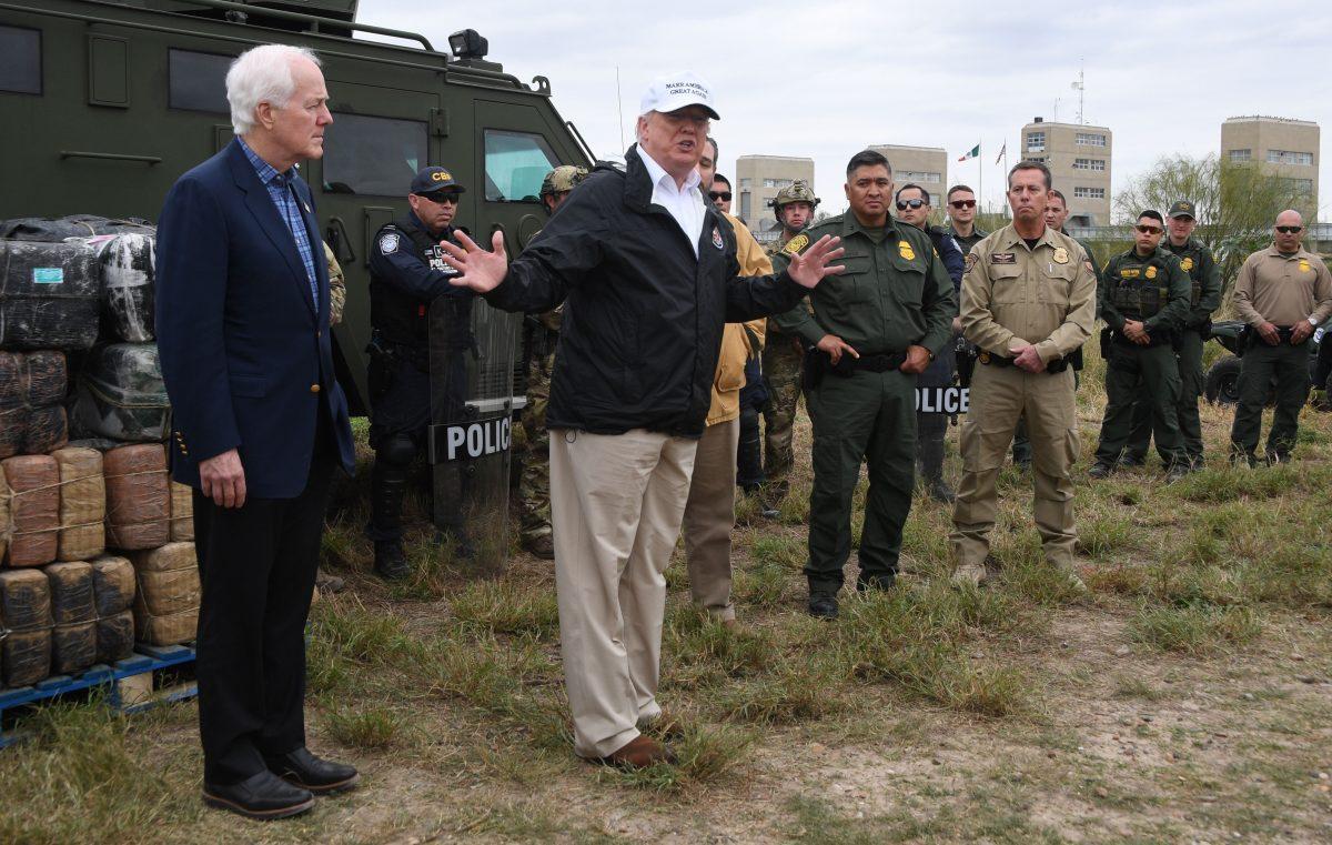 President Donald Trump speaks with Border Patrol agents next to Sen. John Cornyn near the Rio Grande, Texas, on Jan. 10, 2019. (Jim Watson/AFP/Getty Images)