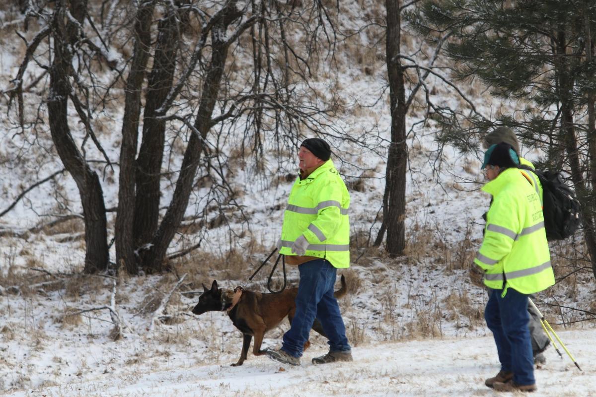 A search-and-rescue team gears up to search for a missing 9-year-old girl in freezing weather near Rockerville, S.D., Monday, Feb. 4, 2019. Authorities say that Serenity Dennard ran away from staff at a residential youth home. (Arielle Zionts/Rapid City Journal via AP)