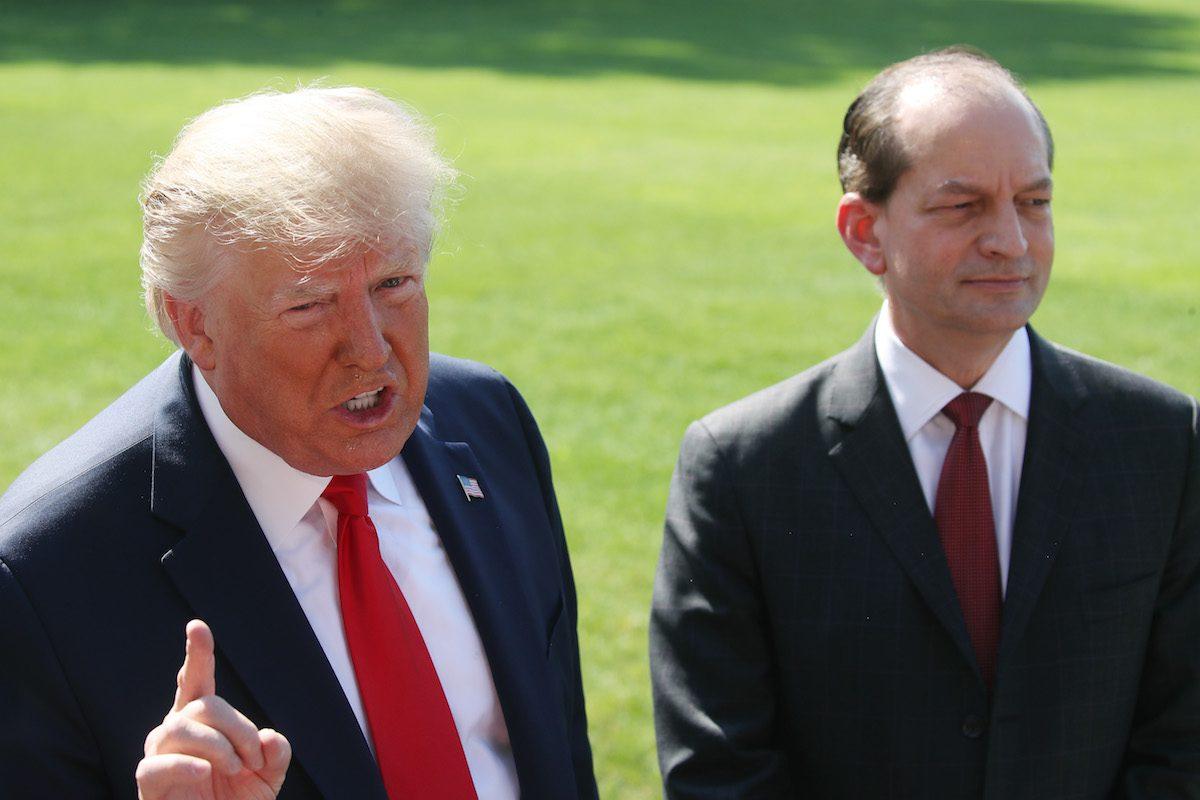 President Donald Trump stands with Labor Secretary Alex Acosta while talking to the media at the White House in Washington on July 12, 2019. (Mark Wilson/Getty Images)
