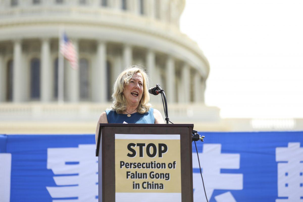 Linda Lagemann, Commissioner at Citizens Commission on Human Rights, speaks at a rally commemorating the 20th anniversary of the persecution of Falun Gong in China, on the West lawn of Capitol Hill in Washington on July 18, 2019. (Samira Bouaou/The Epoch Times)
