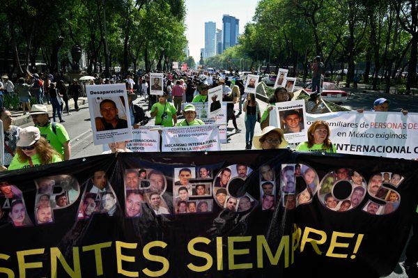 Activists and relatives of missing people march to demand answers about the whereabouts of their loved ones, in Mexico City on May 10, 2019. Mexico recorded 33,513 missing persons until 2017, according to official figures. (ALFREDO ESTRELLA/AFP/Getty Images)