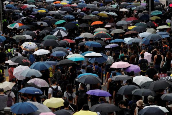 Anti-government protesters march against the anti-mask law during a protest in central Hong Kong, on Oct. 5, 2019. (Jorge Silva/Reuters)