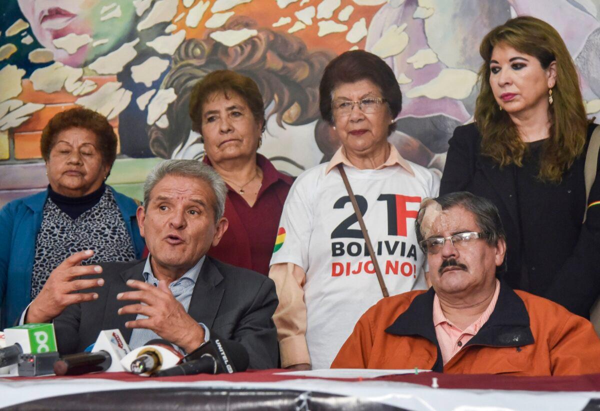 Bolivian members of the National Comite for Democracy Defense (CONADE), Waldo Albarracin (R) and Rolando Villena speak during a press conference calling on the Bolivian people to protest in defense of democracy, in La Paz, on Oct. 27, 2019. (AIZAR RALDES/AFP via Getty Images)
