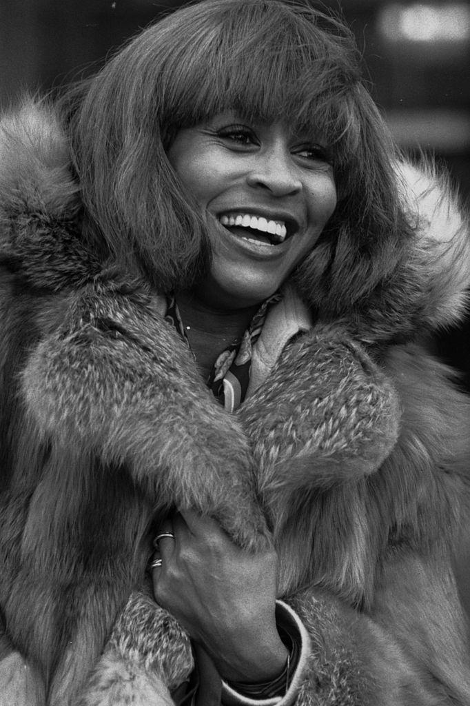 Turner wrapped in furs as she arrives at Heathrow airport in London, England, on Feb. 10, 1978 (©Getty Images | <a href="https://www.gettyimages.com/detail/news-photo/rock-star-tina-turner-wrapped-in-furs-as-she-arrives-at-news-photo/3429704?adppopup=true">Frank Tewkesbury</a>)