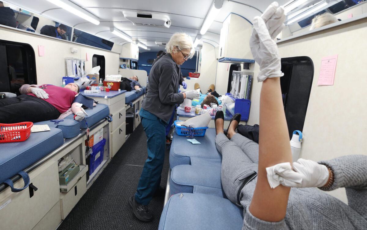 A nurse works as employees donate blood during a blood drive held in a bloodmobile in Los Angeles on March 19, 2020. (Mario Tama/Getty Images)