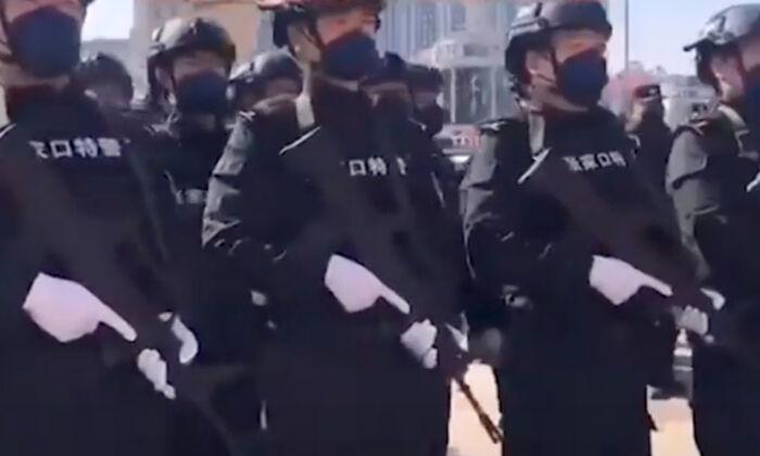 Armed Police Patrol Parts of Beijing As Pandemic Spreads