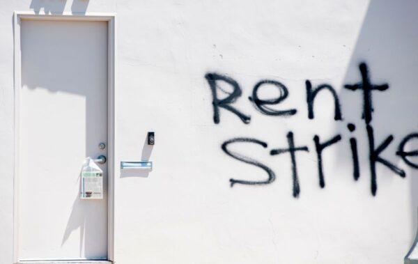Graffiti calling for a rent strike is seen on a wall on La Brea Avenue in Los Angeles, Calif., on May 1, 2020. (Valerie Macon/AFP via Getty Images)