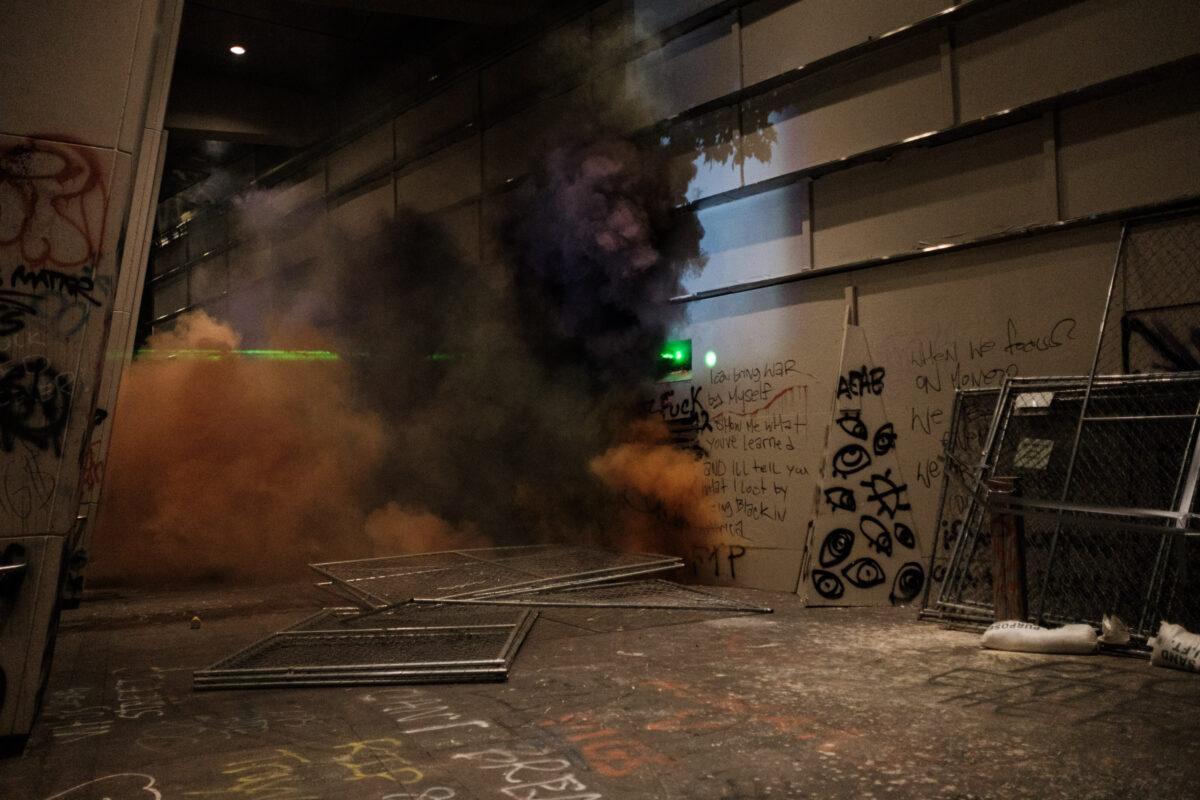 Demonstrators set off smoke grenades on the steps of Mark O. Hatfield Courthouse in Portland, Ore., on July 17, 2020. (Mason Trinca/Getty Images)
