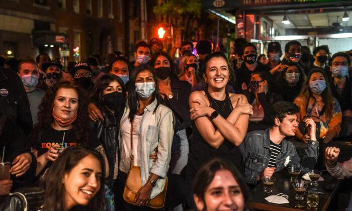 Biden Campaign Urges People to Wear Masks, Social Distance Amid Packed Celebrations