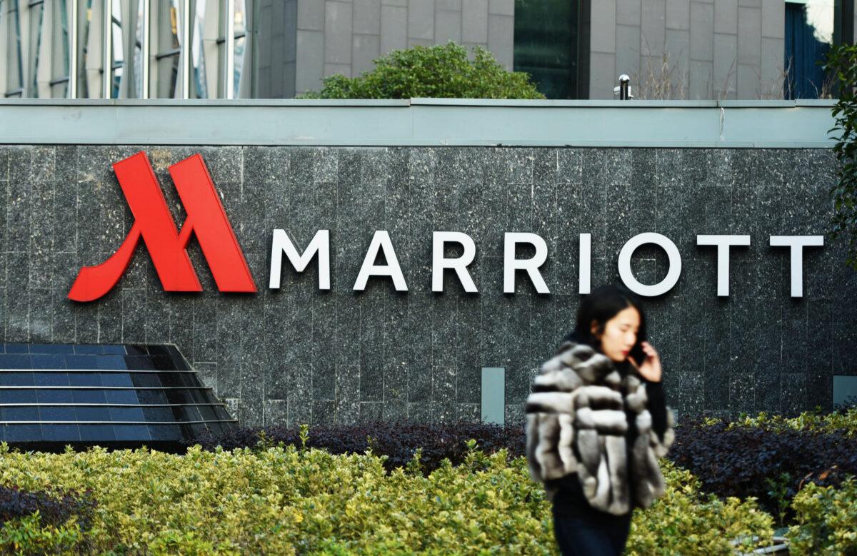 A woman walks past Marriott signage in Hangzhou in China's Zhejiang province on Jan. 11, 2018.<br/>(-/AFP via Getty Images)