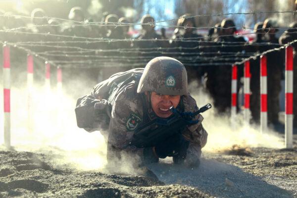 A Chinese People's Liberation Army soldier takes part in military training at the Pamir Mountains in Kashgar, northwestern China's Xinjiang region, on Jan. 4, 2021. (STR/AFP via Getty Images)