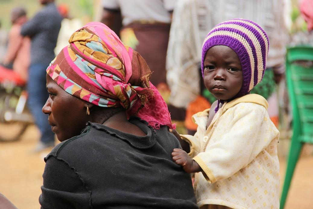 Survivors of a terror attack on May 23 in the community of Kwi, Nigeria, attending a funeral for the victims, in Kwi on May 24, 2021. (Masara Kim)