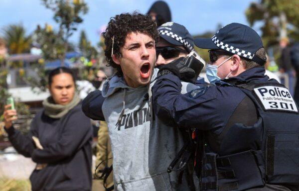 Police arrest a protester during an anti-lockdown rally at St. Kilda in Melbourne on Sept. 25, 2021. (William West/AFP via Getty Images)