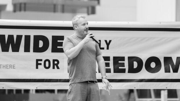 Jed Hansen, Vice-President of the NT Country Liberal Party speaks at a freedom rally in Darwin on Saturday, Jan.22