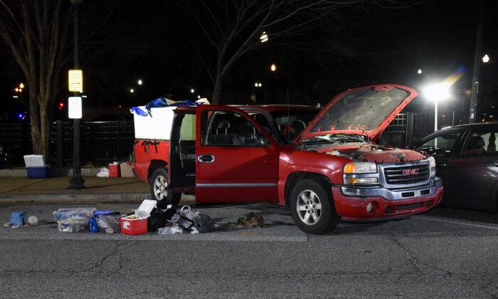 Lonnie Leroy Coffman's GMC Sierra pickup truck was stocked with firearms, ammunition, machetes, and Molotov cocktails on Jan. 6, 2021. (U.S. Department of Justice/Screenshot via The Epoch Times)