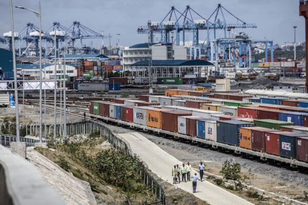 Shipping containers sit beside railway lines running into Mombasa port in Mombasa, Kenya, on Sept. 1, 2018. (Luis Tato/Bloomberg via Getty Images)