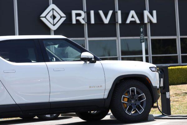 A Rivian electric pickup truck sits in a parking lot at a Rivian service center in South San Francisco on May 9, 2022. (Justin Sullivan/Getty Images)
