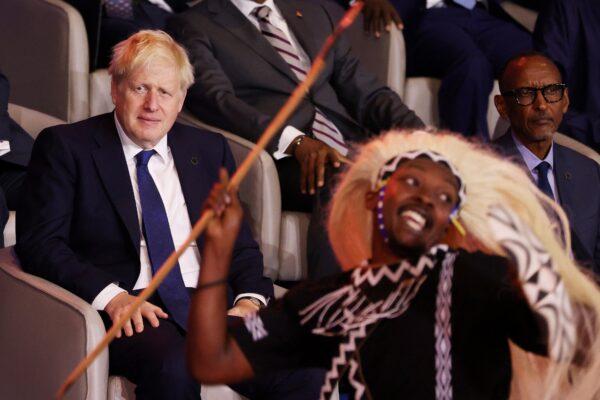 British Prime Minister Boris Johnson and Rwandan President Paul Kagame look on the opening ceremony of the Commonwealth Heads of Government Meeting at Kigali Convention Centre, in Kigali, Rwanda, on June 24, 2022. (Dan Kitwood/Getty Images)
