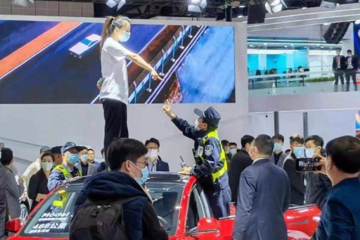 In April 2021, a Tesla owner Ms. Zhang protested at a Tesla car show in Shanghai, claiming brake failure as the reason for an accident in a Tesla Model 3.  (Courtesy of reader)