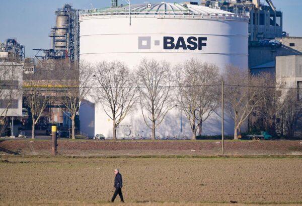 A man walks past tanks of German chemicals giant BASF at the company's headquarters in Ludwigshafen, western Germany, on Feb. 26, 2019. (Uwe Anspach/DPA/AFP via Getty Images)