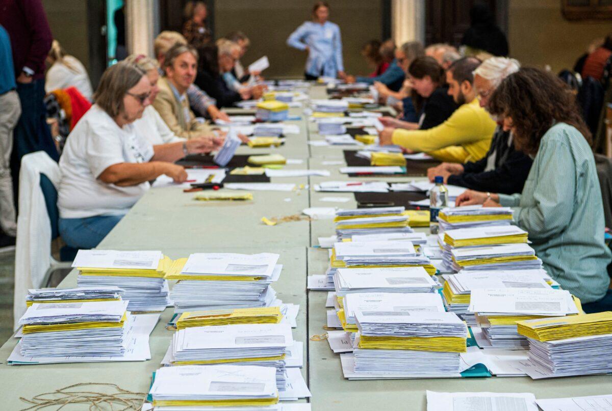 Envelopes with votes are pictured as helpers count the last votes in the municipality of Stockholm at the Stockholm City Hall on September 14, 2022. (Jonathan Nackstrand/AFP)