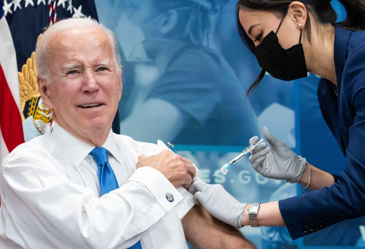 President Joe Biden receives the latest COVID-19 booster shot in the South Court Auditorium of the Eisenhower Executive Office Building, next to the White House, on Oct. 25, 2022. (Saul Loeb/AFP via Getty Images)