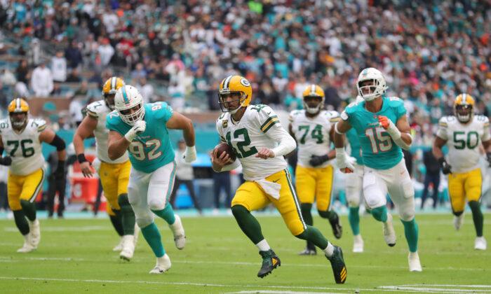 Late Interceptions Help Packers Beat Dolphins