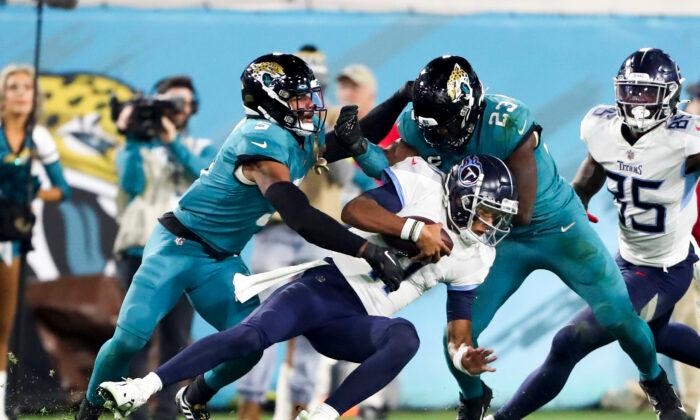 Jags Return Fumble for TD, Beat Titans for AFC South Title