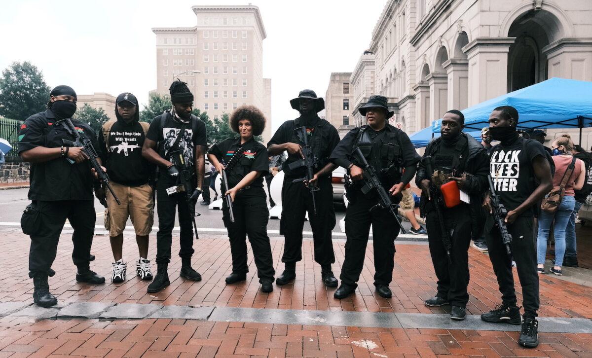 Black Lives Matter demonstrators pose with guns in support of the Second Amendment during an open carry rally in Richmond, Va., on August 15, 2020. (Eze Amos/Getty Images)