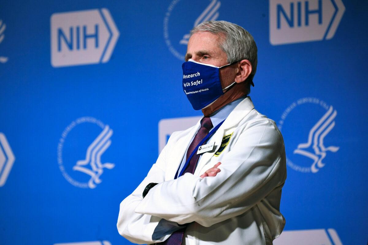 NIAID director Dr. Anthony Fauci listens to President Joe Biden (out of frame) speak during a visit to the National Institutes of Health (NIH) in Bethesda, Md., on Feb. 11, 2021. (Saul Loeb/AFP via Getty Images)