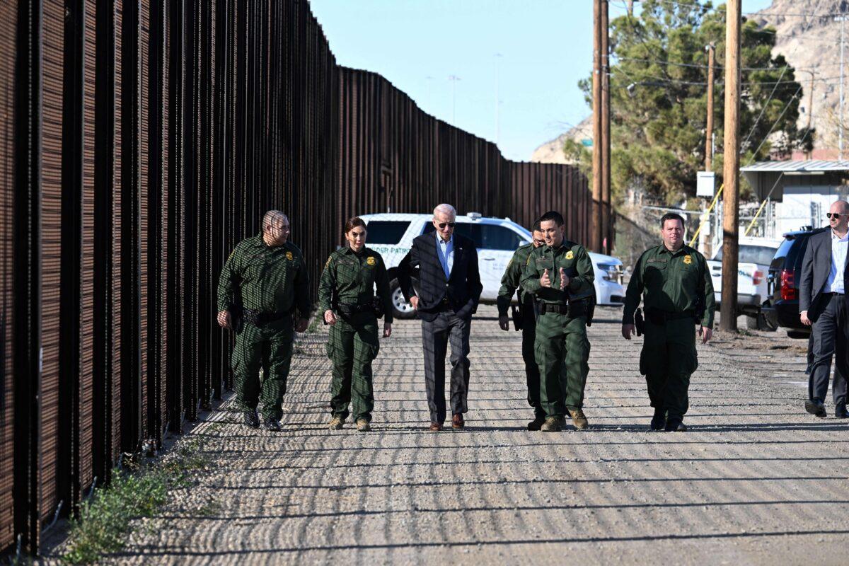 President Joe Biden speaks with members of the U.S. Border Patrol as they walk along the U.S.-Mexico border fence in El Paso, Texas, on Jan. 8, 2023. (Jim Watson/AFP via Getty Images)