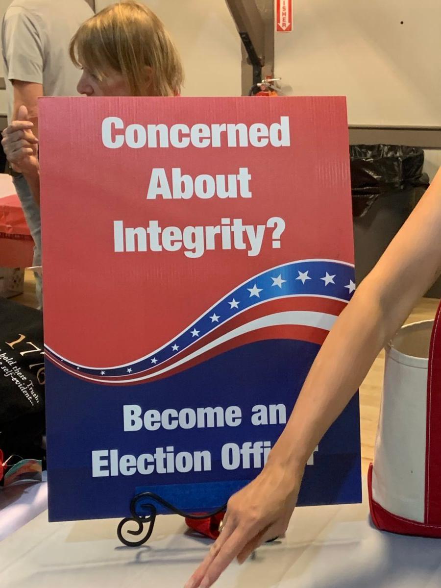 A sign used to recruit election integrity volunteers at a Republican election event in Loudoun County, Va., on June 8, 2023. (Masooma Haq/The Epoch Times)