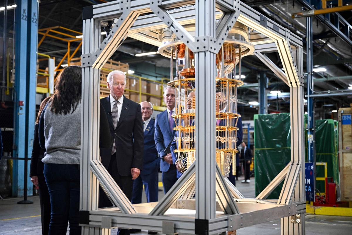 U.S. President Joe Biden looks at a quantum computer as he tours the IBM facility in Poughkeepsie, New York, on Oct. 6, 2022. IBM hosted President Biden to celebrate the announcement of a $20-billion investment in semiconductors, quantum computing, and other cutting-edge technology in New York state. (Mandel Ngan/AFP via Getty Images)