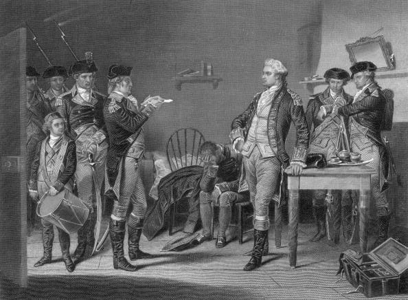 British soldier Maj. John André receiving a death warrant from the Continental Army after being charged as a spy for negotiating the betrayal of West Point with Benedict Arnold and hiding the incriminating papers in his boot. (Hulton Archive/Getty Images)