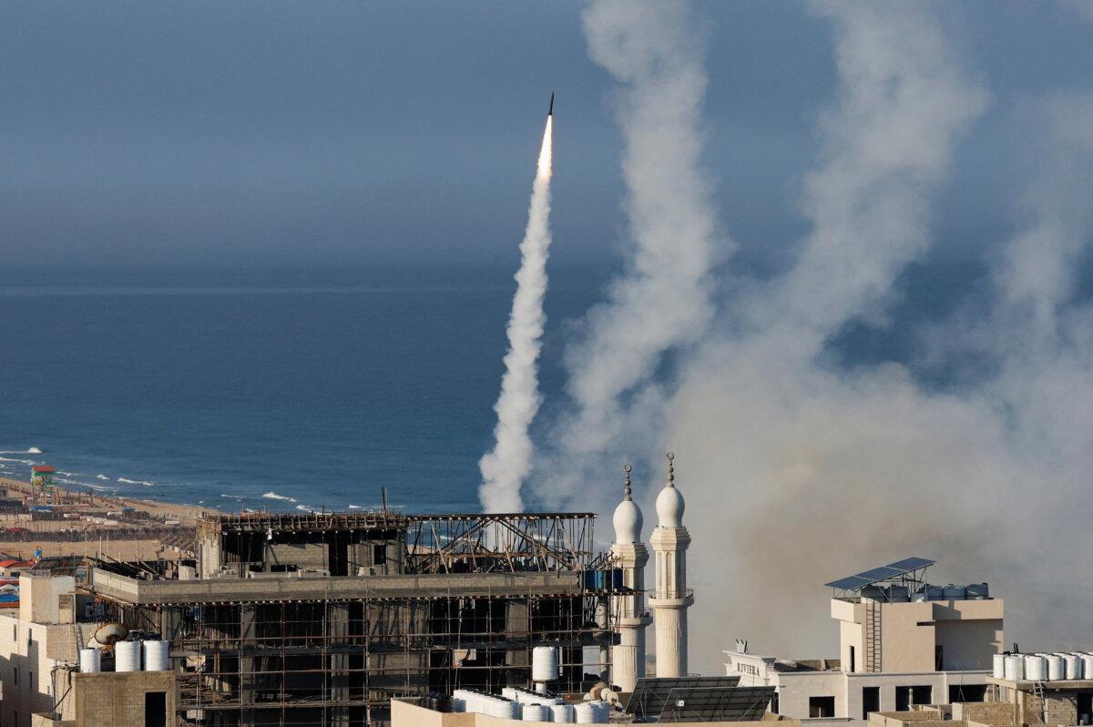 Rockets are fired by Hamas terrorists into Israel from Gaza City on Oct. 7, 2023. (Mohammed Salem/Reuters)