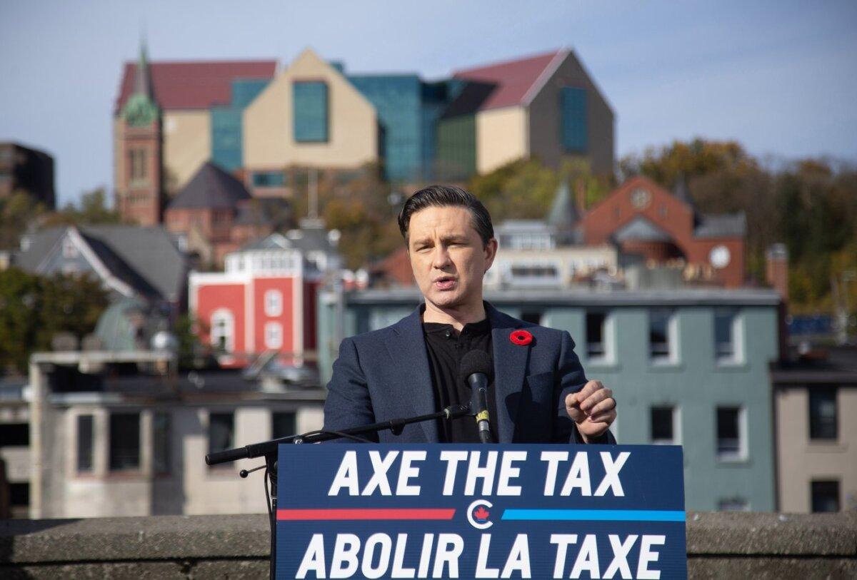 Conservative Leader Pierre Poilievre holds a press conference regarding his “Axe the Tax” message from the roof of a parking garage in St. John's, on Oct.27, 2023. (The Canadian Press/Paul Daly)